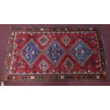 A South West Persian Lor Rug, the triple pole medallion with repeating petal motifs on a