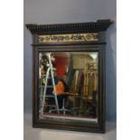 A Victorian ebonized and part gilt over mantle mirror with bevelled plate, 100 x 91cm