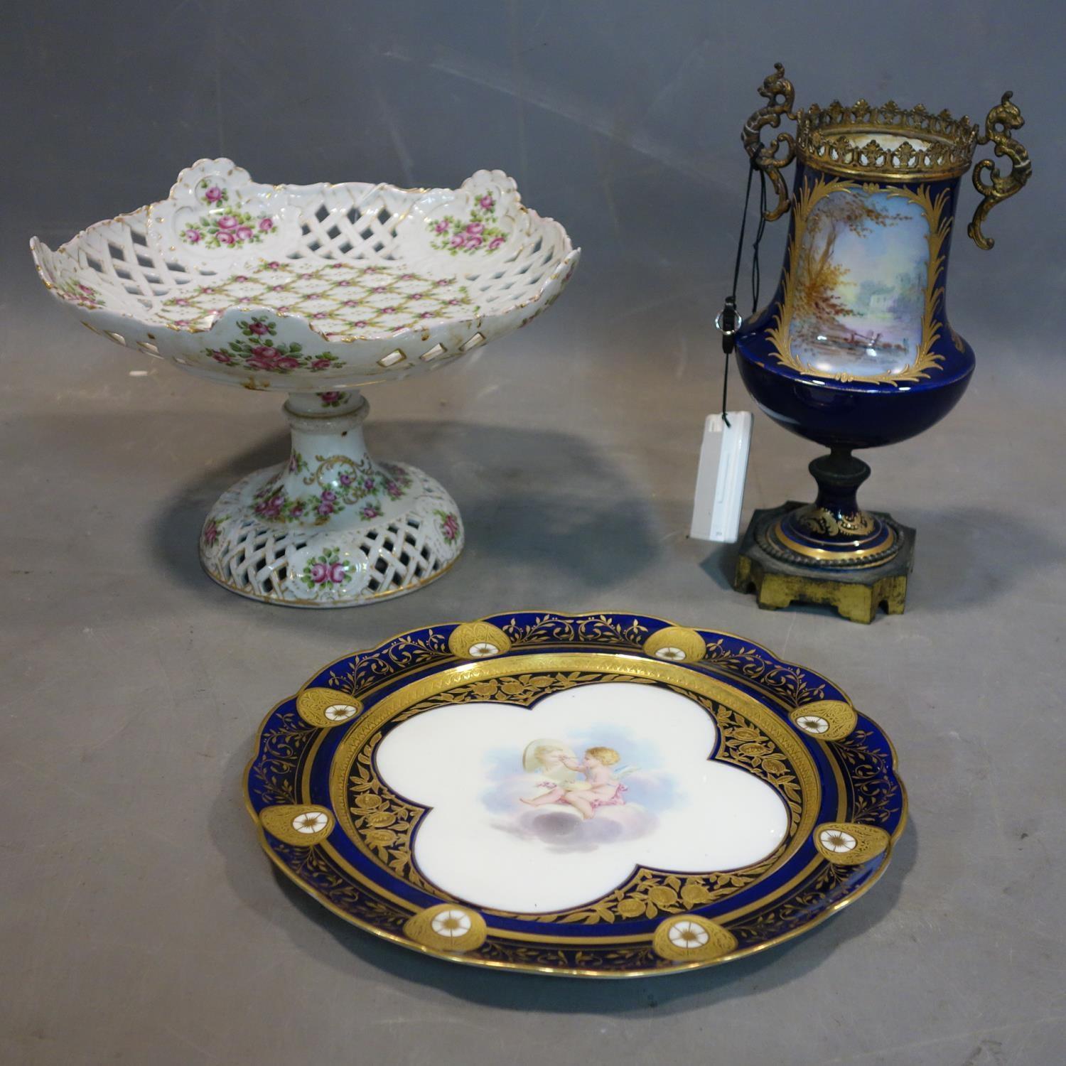 A 19th century French porcelain and gilt metal urn, signed and lacking cover, together with a 19th