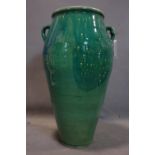 A Persian green glazed Sharab wine vessel, H.76cm