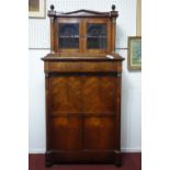 A 19th century rosewood bureau bookcase, with architectural pediment above twin brass capped pillars