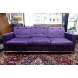 A Somerville Scott & Company sofa with purple linen upholstery, 1 arm is ripped, H.79 W.219 D.87cm
