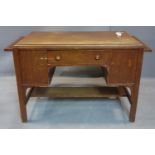 An American craftsman style oak desk, with single drawer that reveals fitted interior with letter