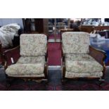 A pair of early 20th century Queen Anne style bergere armchairs, one with damaged caning