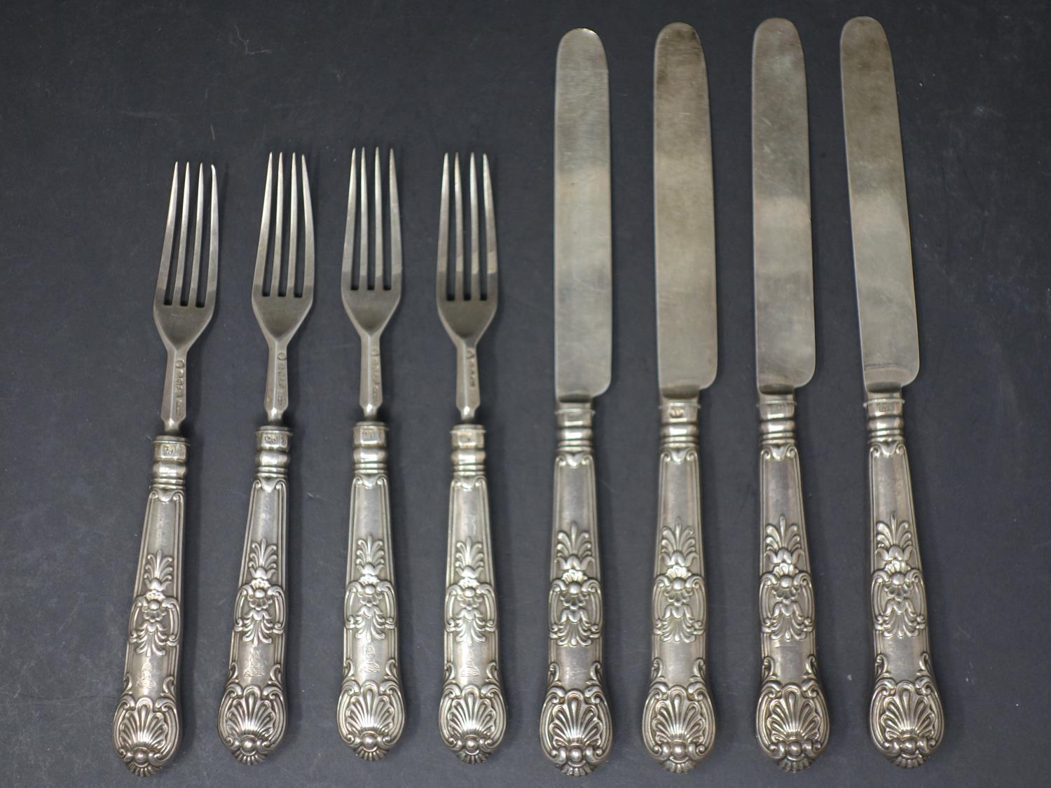 A set of four William IV filled silver knives and forks