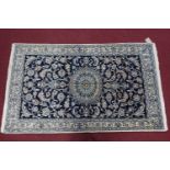 A Central Persian part silk Nain rug, central double pedant medallion with repeating petal motifs on