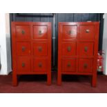 A pair of Chinese red lacquered chests of six drawers, raised on square legs, H.78 W.47 D.40cm