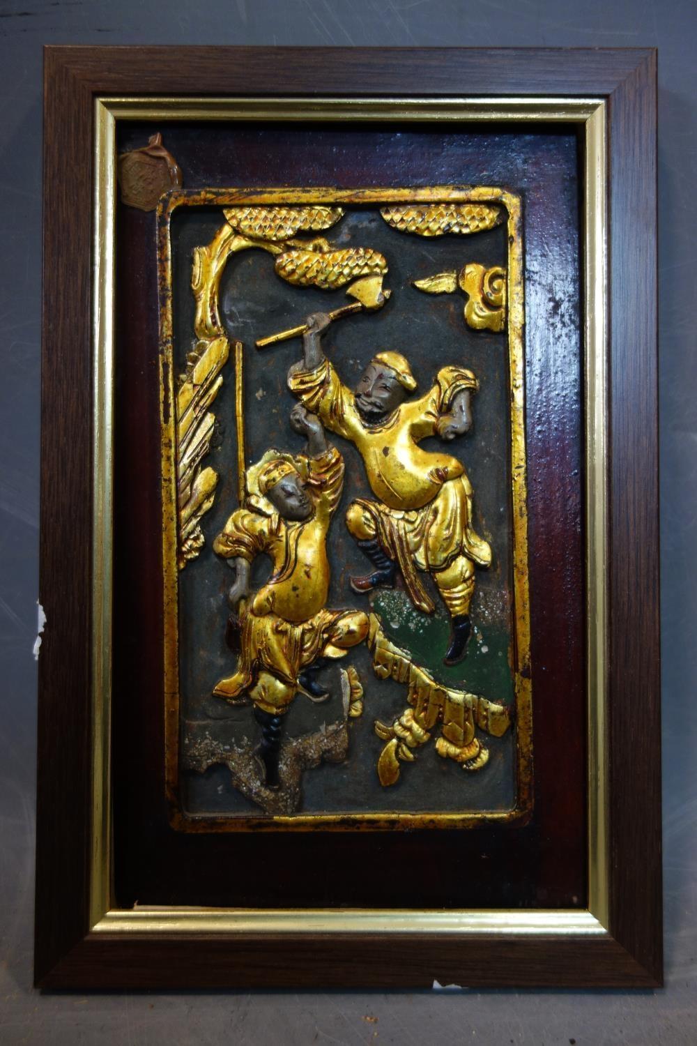 A Chinese carved wood panel, gold lacquer with some colour, of two fighting warriors, 230mm x - Image 2 of 2