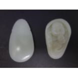 Two contemporary Chinese celadon jade pendants