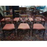 A set of 7 Georgian bar back dining chairs on X-stretchered turned supports, to include one carver