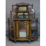 A Victorian walnut mirrored back sideboard, having two tier pierced gallery top decorated with