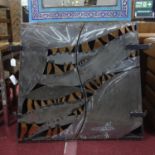 A Matthew Nixon Industrial metal cupboard of unusual form, with pierced doors revealing shelf, H.