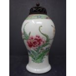 A Chinese porcelain baluster vase with carved hardwood lid in coloured red peony and green leaf