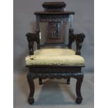 A carved hardwood dragon chair with straight back, shaped front, carved and pierced frame with