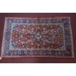 A Central Persian Kashan rug, double pendant central medallion with repeating petal motifs on a