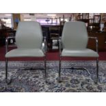 A pair of Sitland cantilever chairs, maker's mark to reverse (2)