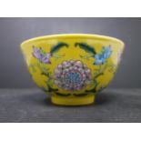 A Chinese imperial yellow-ground falangcai ?floral? bowl, 19 century, diam. 15 cm