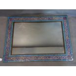 A 20th century tiled wall mirror, with rectangular glass plate within metal frame with turquoise