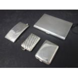 A collection of four silver cases, to include an engine turned cigarette case with gilded interior