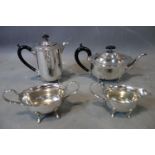 A silver plated four-piece tea and coffee set including tea pot, coffee pot and milk jug and sugar