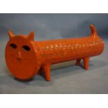 An Italian orange glaze studio pottery cat, marked to reverse, numbered 035/749, H.18 W.36cm