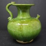 A Chinese Tung style green glazed jug, with shaped handle and flared rim, H.17.5cm