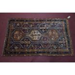 A South West Persian Lori rug, bearing repeating stylised pole medallion within stylised multi