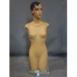 An Art Deco French mannequin, marked 'A La Violette - Marque Deposse', on stepped base, H.116cm