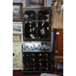 A Chinese style lacquered bureau bookcase, with allover figural decoration. H.225 W.93 D.50cm