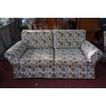 A 20th century two seater sofa with geometric upholstery