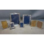A collection of 5 silver clad picture frames of varying size, to include a large picture frame