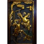 A Chinese carved wood panel, gold lacquer with some colour, of two fighting warriors, 230mm x