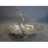 A George III silver swing handled fruit basket, Edward Aldridge II, London 1766, of pierced oval