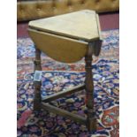 A Victorian oak drop-leaf handkerchief table H.50, D.35 cm