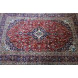 A Central Persian Kashan carpet, central double pendant medallion with repeating petal motifs and