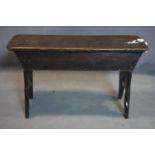 A late 19th century oak stool, on bracket supports, H.51 W.86 D.27cm