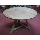 An Arts & Crafts circular table, raised on splayed legs joined by stretchers, H.68cm Diameter 115cm