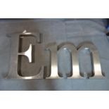 Two large vintage metal advertising letters, 'ME', 62 x 104cm (M) and 86 x 74cm (E)