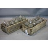 Two wooden crates, one with 10 vintage glass bottles, the other with 9 vintage glass bottles, H.16