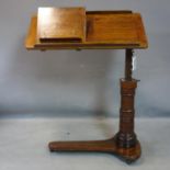 A Victorian mahogany adjustable reading/music stand, with label for 'Leveson & sons', raised on