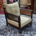 An Edwardian mahogany bergere armchair