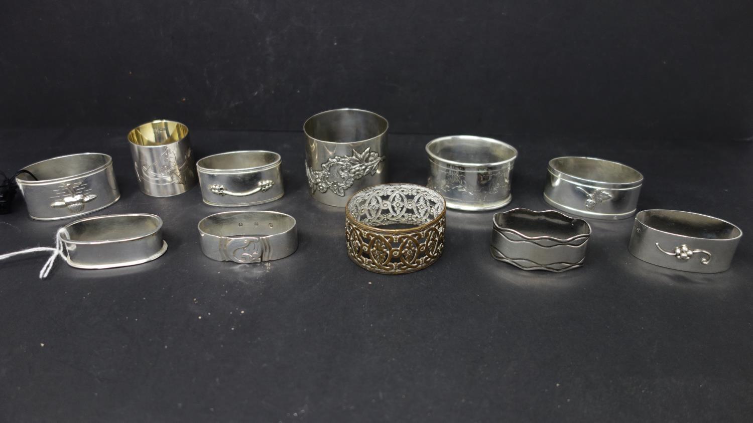 A collection of silver napkin rings, to include a Russian Art Nouveau example with gilded interior
