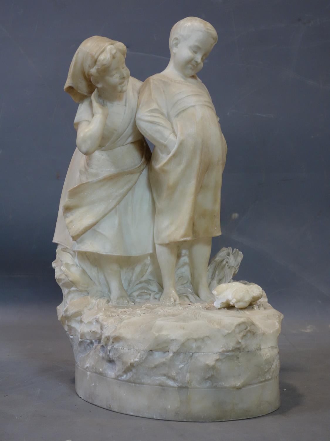 Ferdinando Vichi, Italian, (1875-1945), alabaster sculpture of a boy and girl looking at a cat,