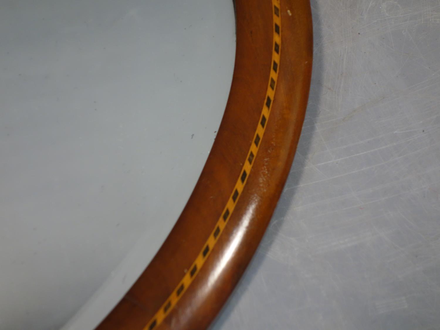 A mahogany inlaid oval wall mirror, with bevelled glass plate, 60 x 89cm - Image 2 of 2