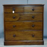 A Victorian mahogany chest of two short over three long drawers, raised on a pedestal base, H.110