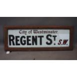 A vintage 'City of Westminster Regent Street S.W.' sign, in wooden frame, 34 x 92cm