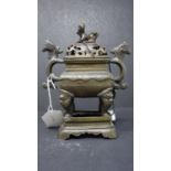 A 20th century Chinese bronze incense burner on stand, with character marks to base, H.20cm