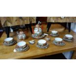 An early 20th century Japanese egg shell porcelain part tea set