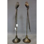 A pair of bronzed birds on stands, H.83cm