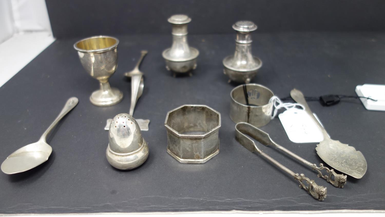 A mixed collection of silver, to include two salts, a small cup with gilded interior, teaspoons,